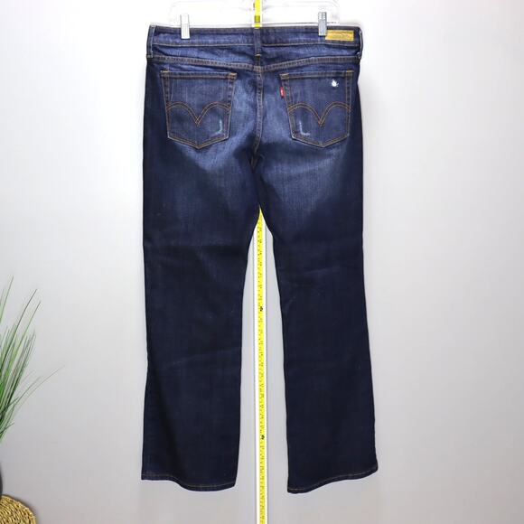 Levi’s 545 Low Boot Cut Jeans Size 12 Medium Dark Wash Distressed - Picture 2 of 4